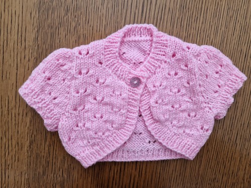 Hand knitted sleeved baby - hand,