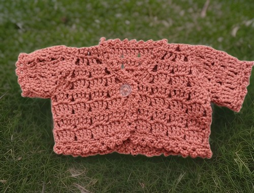 Hand crocheted baby rust - hand,