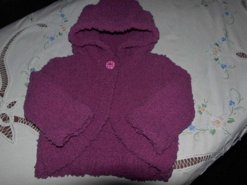 Hand knitted baby girl - hand,