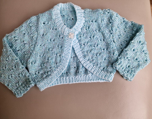 Hand knitted sleeved baby - hand,